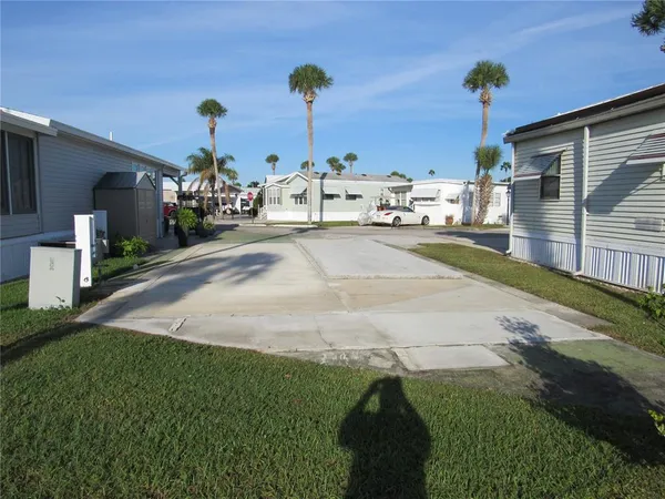 a view of a street in front of a house