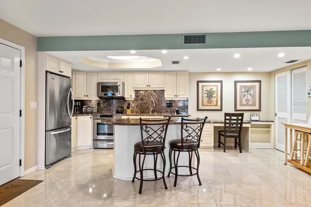 a bedroom with a bed and a table in it