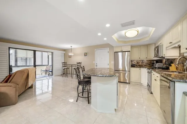 a bathroom with a double vanity sink toilet and shower