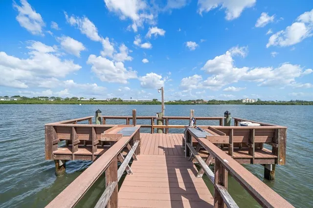 a bedroom with furniture and a large window