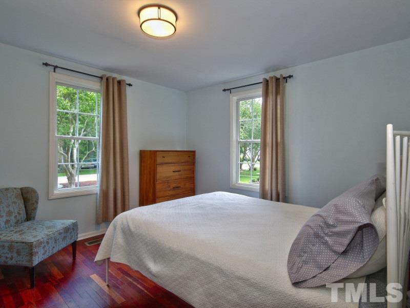 311 Colleton Road Raleigh, NC 27610 - Photo 12 of 22 a bedroom with a bed and a window