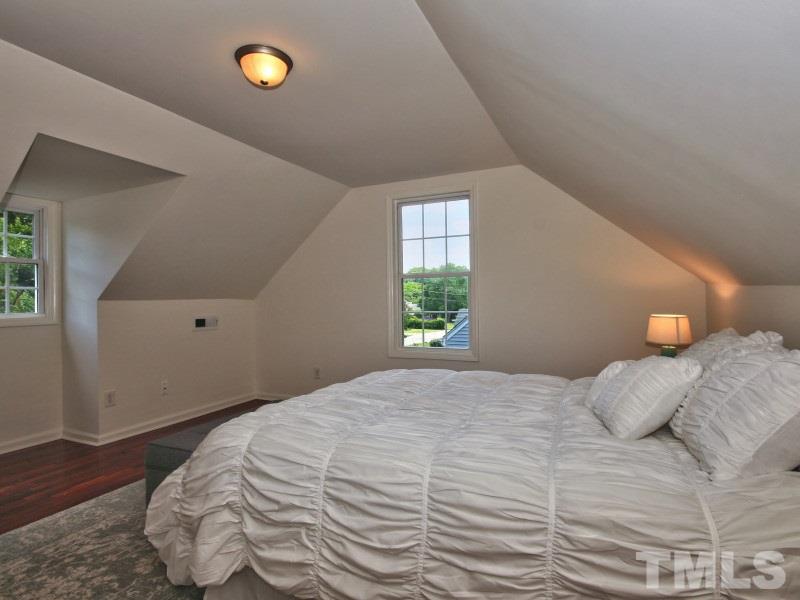 311 Colleton Road Raleigh, NC 27610 - Photo 19 of 22 a bedroom with a bed and a window