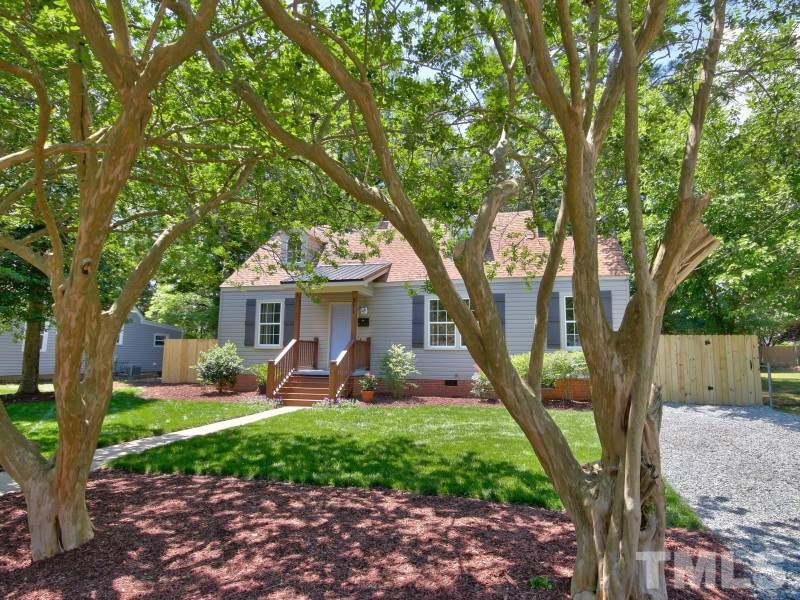 311 Colleton Road Raleigh, NC 27610 - Photo 3 of 22 a view of a house with backyard and a tree