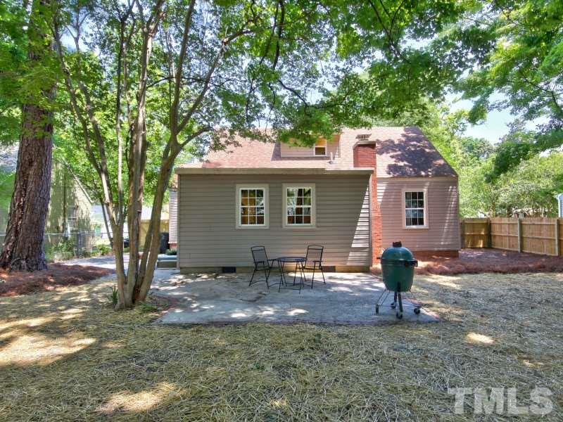 311 Colleton Road Raleigh, NC 27610 - Photo 22 of 22 a backyard of a house with table and chairs