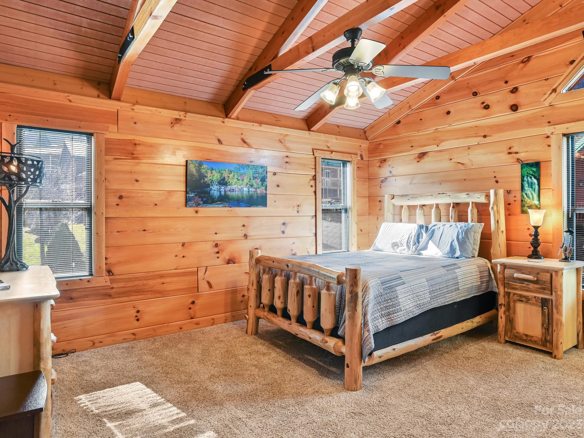 356 Panoramic Loop Maggie Valley, NC 28751 - Photo 15 of 24 a view of a bedroom with a bed and wooden floor