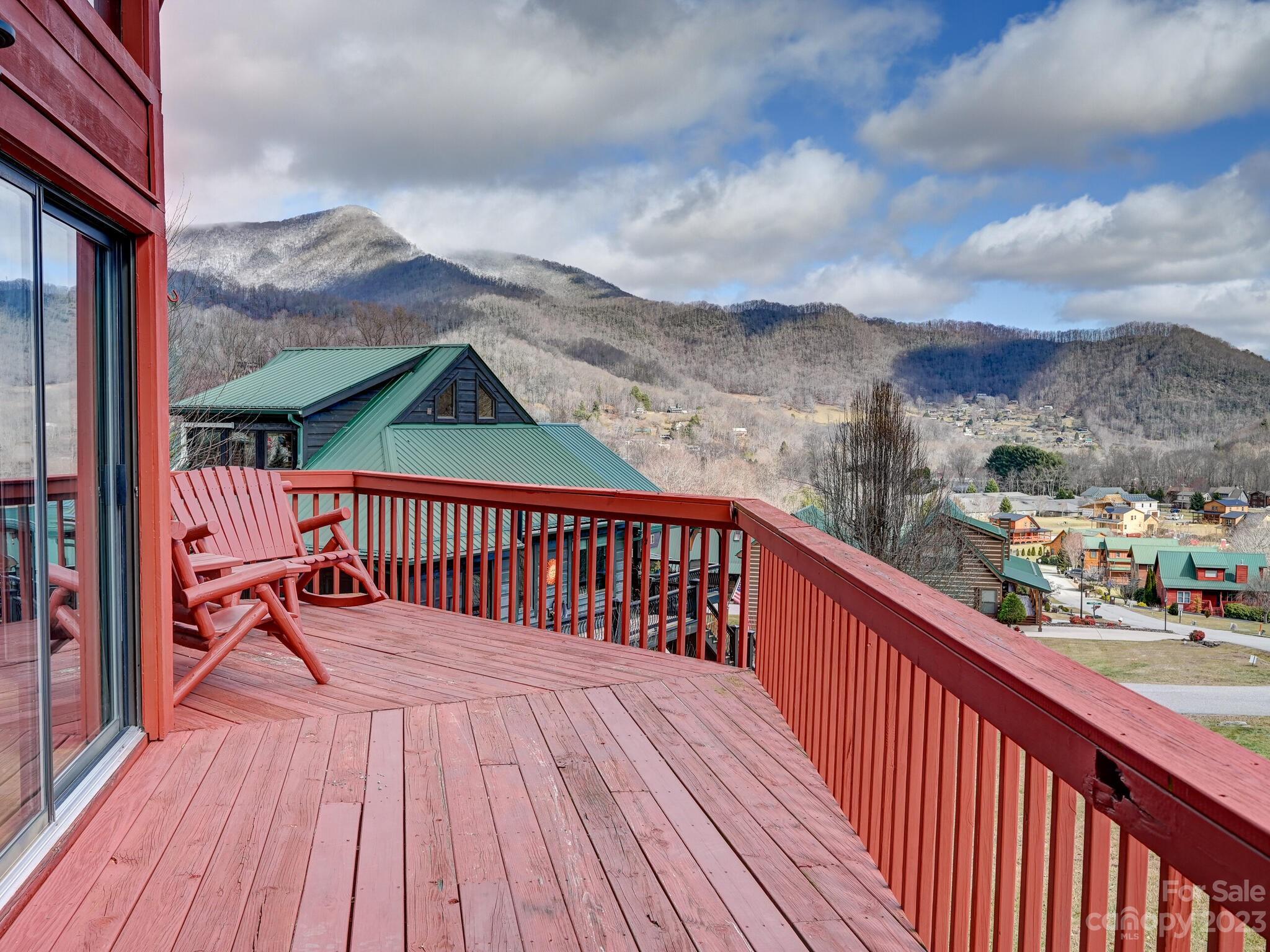 356 Panoramic Loop Maggie Valley, NC 28751 - Photo 2 of 24 a balcony with an outdoor seating
