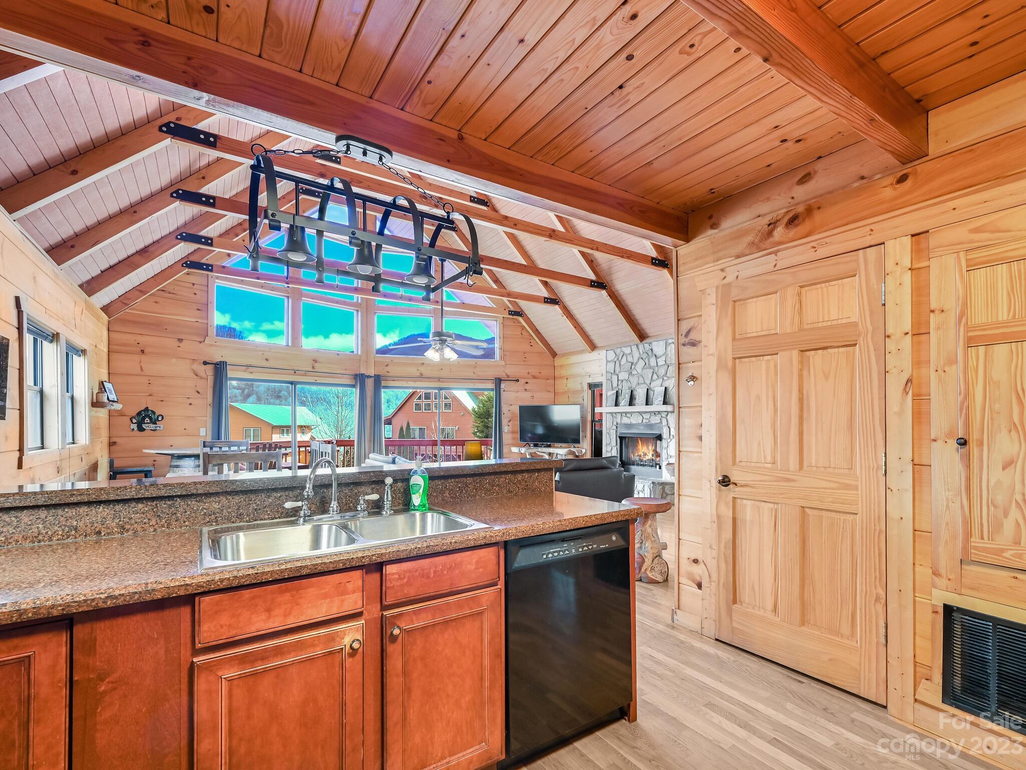 356 Panoramic Loop Maggie Valley, NC 28751 - Photo 9 of 24 a kitchen with stainless steel appliances granite countertop a sink and cabinets