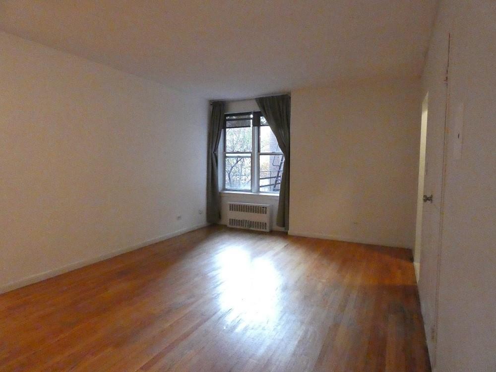 800 Grand Concourse Bronx, NY 10451 - Photo 1 of 1 an empty room with wooden floor and windows