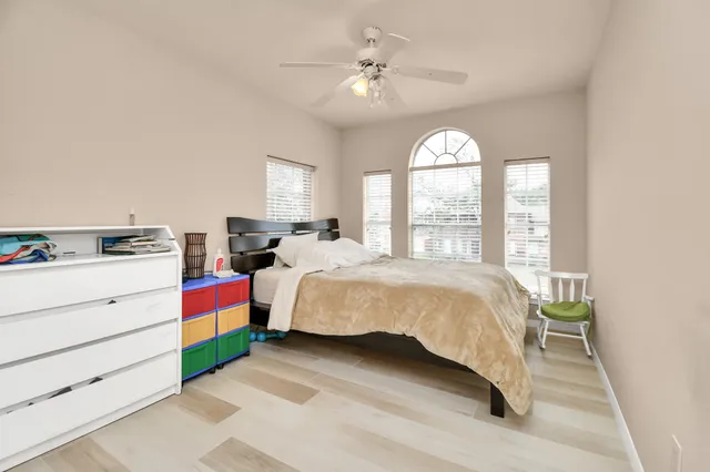 a view of a livingroom with workspace and a window