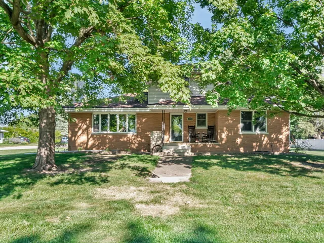 front view of a house with a yard