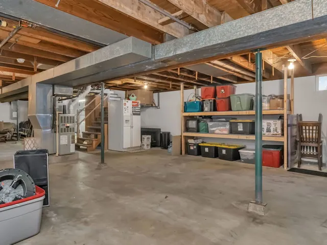 a utility room with sink dryer and washer