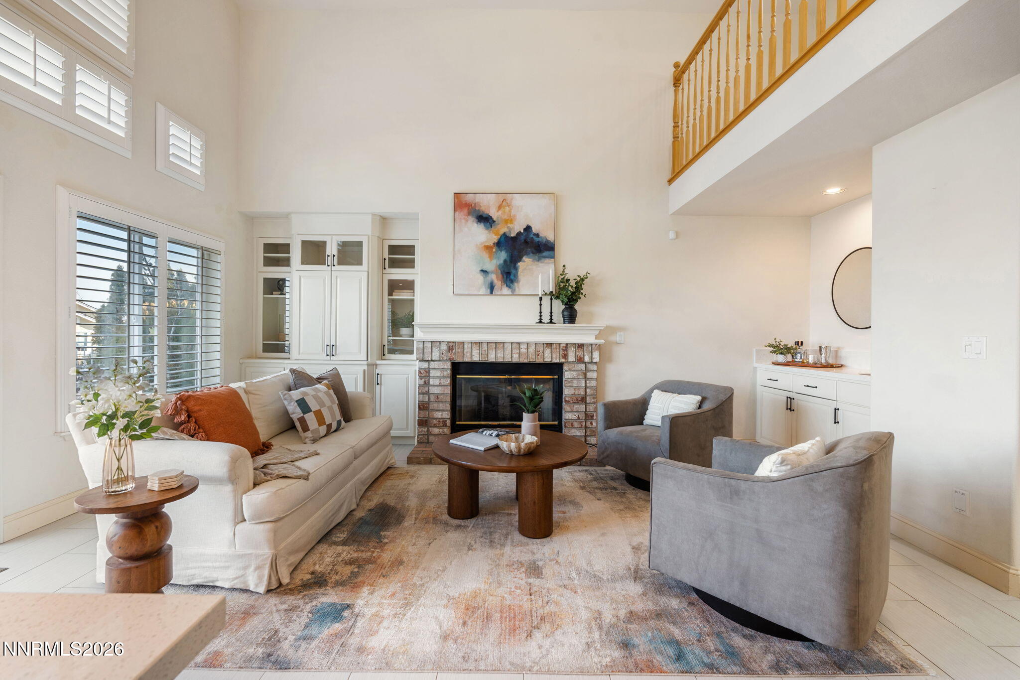 6186 Squires Lane Reno, NV 89519 - Photo 19 of 57 a living room with furniture and a fireplace