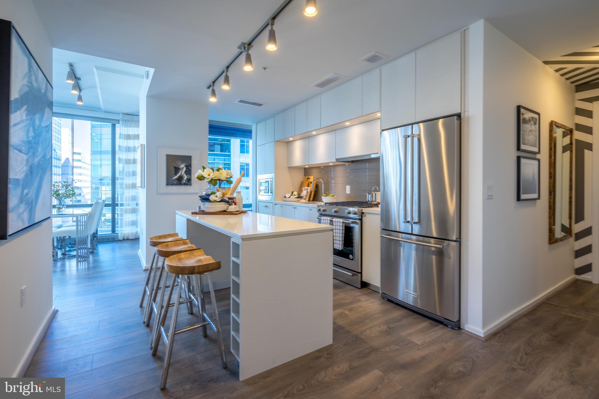 1800 North Lynn Street, Unit 2316 Arlington, VA 22209 - Photo 4 of 11 a kitchen with refrigerator a sink dishwasher and a refrigerator