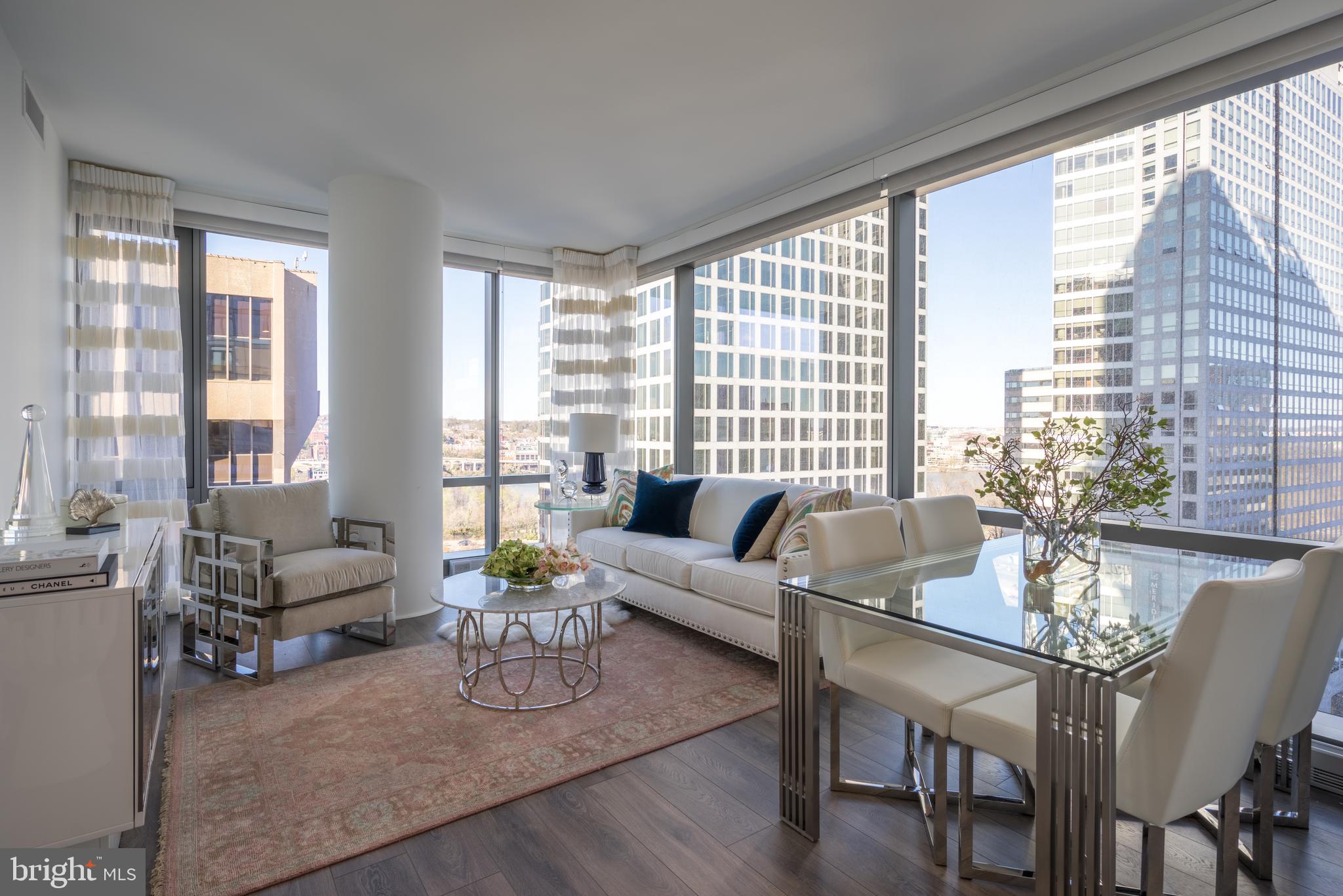1800 North Lynn Street, Unit 2316 Arlington, VA 22209 - Photo 5 of 11 a living room with furniture and floor to ceiling windows
