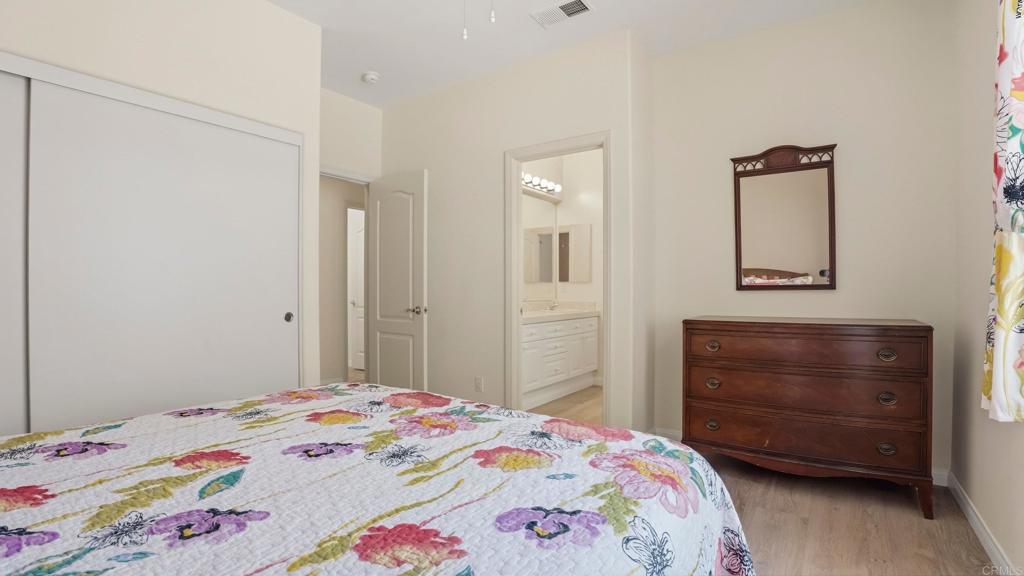 2527 Southern Oak Road Ramona, CA 92065 - Photo 32 of 56 a bedroom with a bed and a dresser