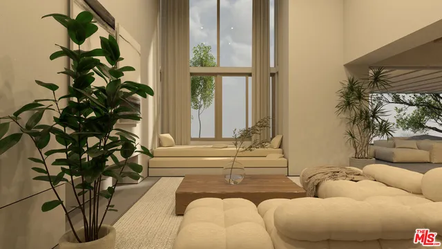 a living room with furniture plant and a window
