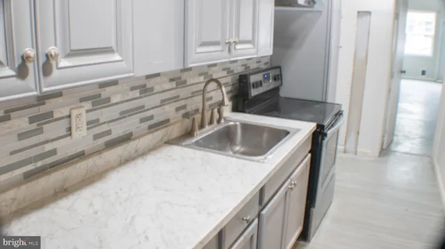 a view of a kitchen with a sink and dishwasher kitchen view