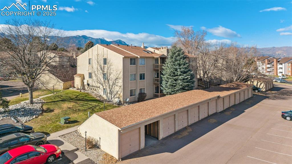 918 Tenderfoot Hill Road, Unit 202 Colorado Springs, CO 80906 - Photo 1 of 48 a view of a house with a yard