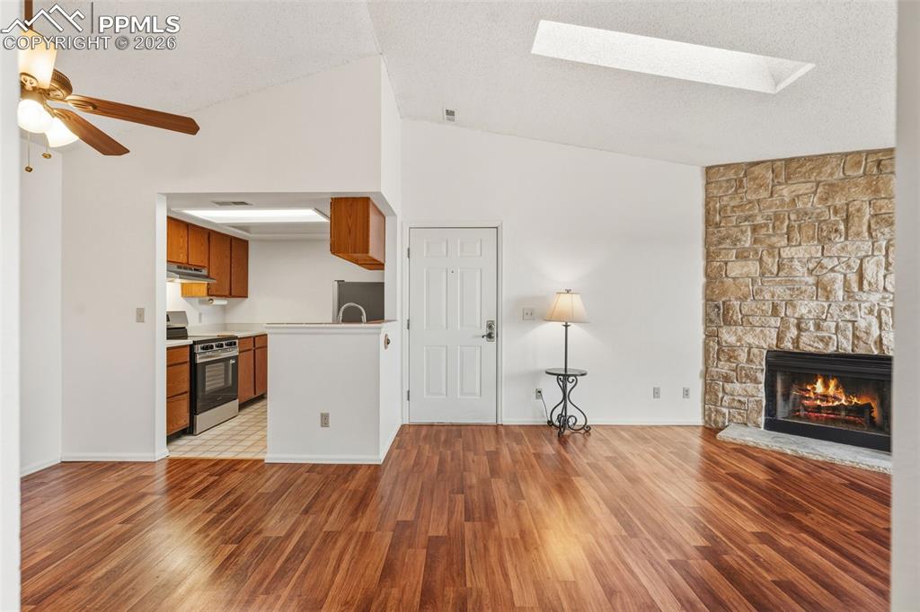 918 Tenderfoot Hill Road, Unit 202 Colorado Springs, CO 80906 - Photo 11 of 48 a bedroom with a bed and a fireplace