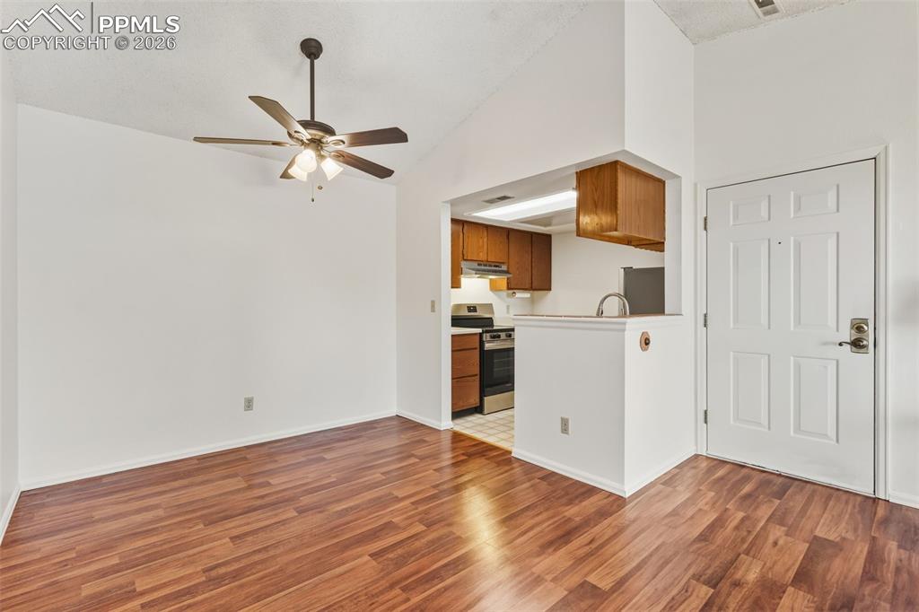 918 Tenderfoot Hill Road, Unit 202 Colorado Springs, CO 80906 - Photo 13 of 48 a view of a kitchen with wooden floor