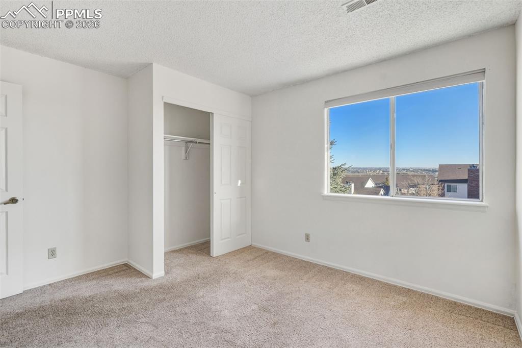 918 Tenderfoot Hill Road, Unit 202 Colorado Springs, CO 80906 - Photo 25 of 48 an empty room with a window
