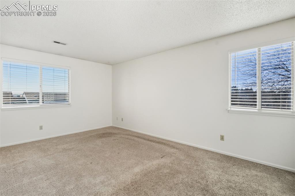 918 Tenderfoot Hill Road, Unit 202 Colorado Springs, CO 80906 - Photo 29 of 48 an empty room with windows