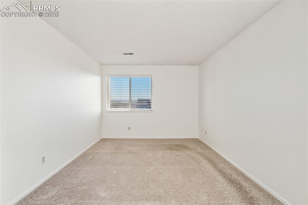 918 Tenderfoot Hill Road, Unit 202 Colorado Springs, CO 80906 - Photo 31 of 48 an empty room with a window