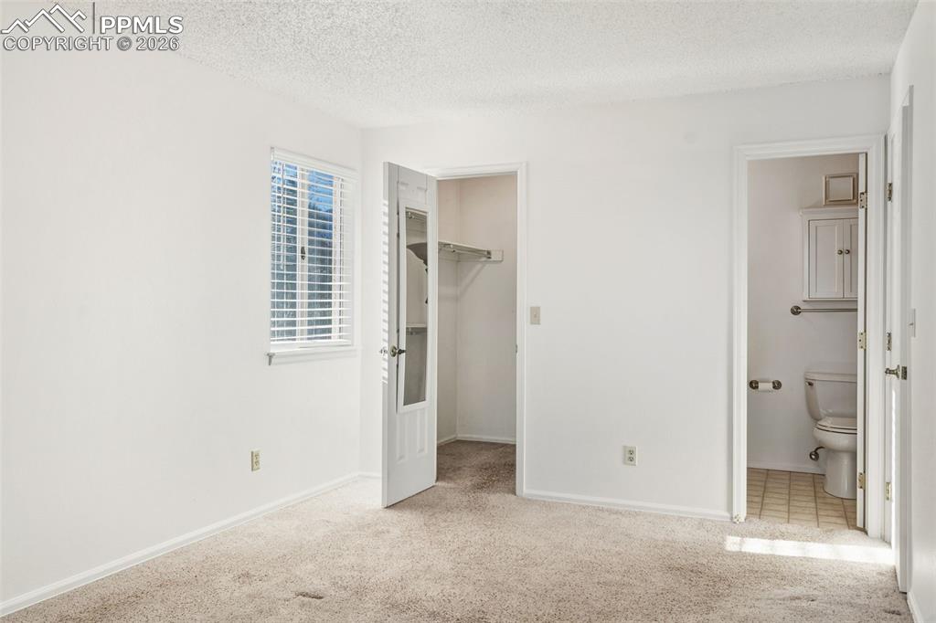 918 Tenderfoot Hill Road, Unit 202 Colorado Springs, CO 80906 - Photo 32 of 48 a view of an empty room with a bathroom