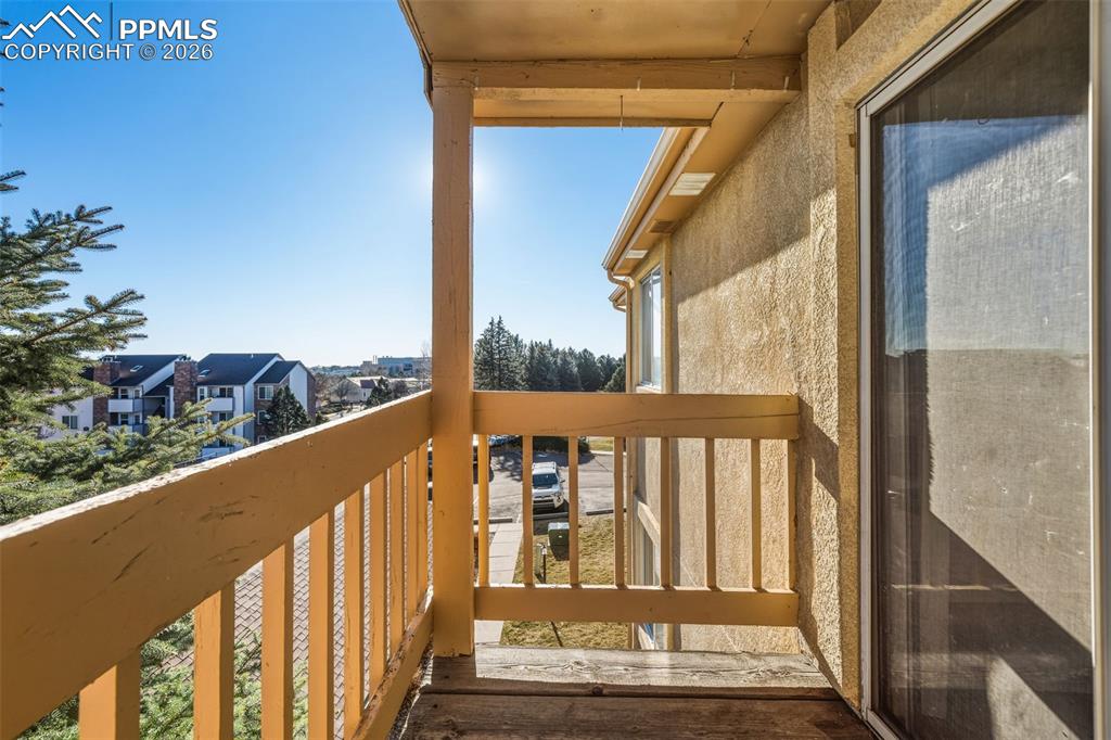 918 Tenderfoot Hill Road, Unit 202 Colorado Springs, CO 80906 - Photo 36 of 48 a view of a balcony with wooden floor