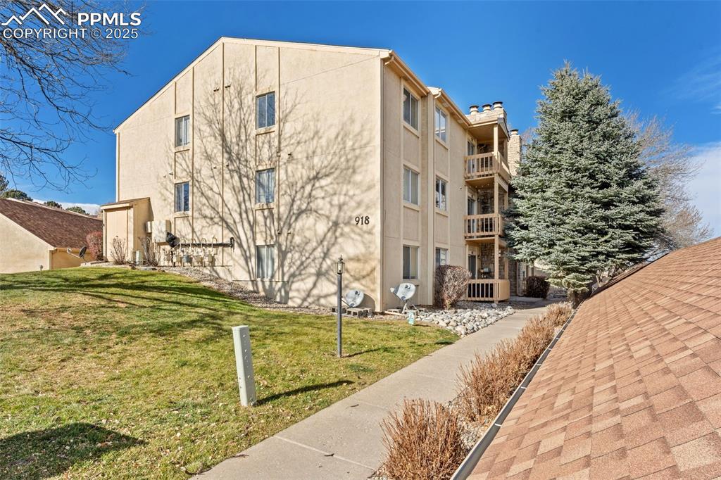 918 Tenderfoot Hill Road, Unit 202 Colorado Springs, CO 80906 - Photo 38 of 48 a view of swimming pool with building