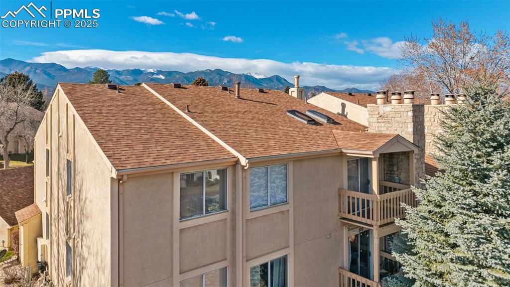 918 Tenderfoot Hill Road, Unit 202 Colorado Springs, CO 80906 - Photo 39 of 48 a view of a house with a backyard