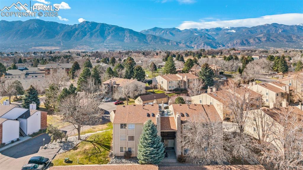 918 Tenderfoot Hill Road, Unit 202 Colorado Springs, CO 80906 - Photo 43 of 48 an aerial view of residential house and green space