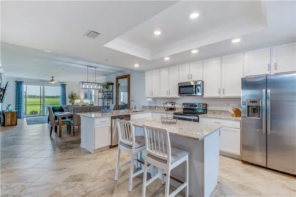 a kitchen with counter space cabinets and appliances