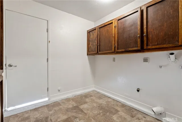 a view of a room with wooden floor and windows