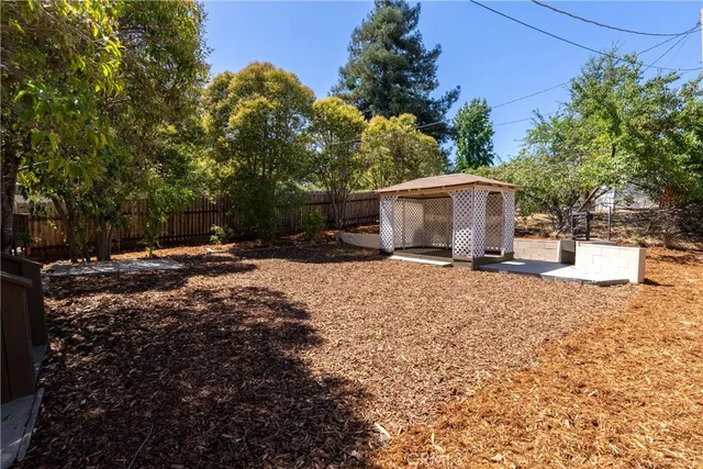 a view of a roof deck with wooden fence and floor