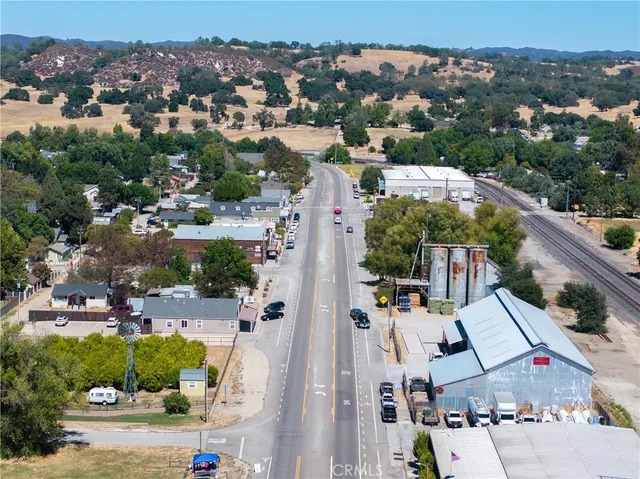 an aerial view of residential building and lake
