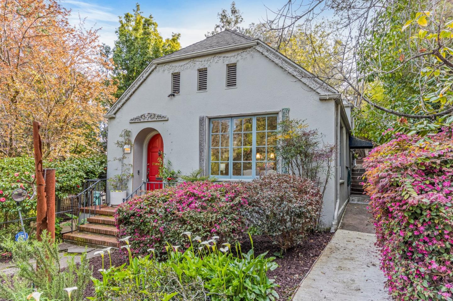 a front view of a house with garden