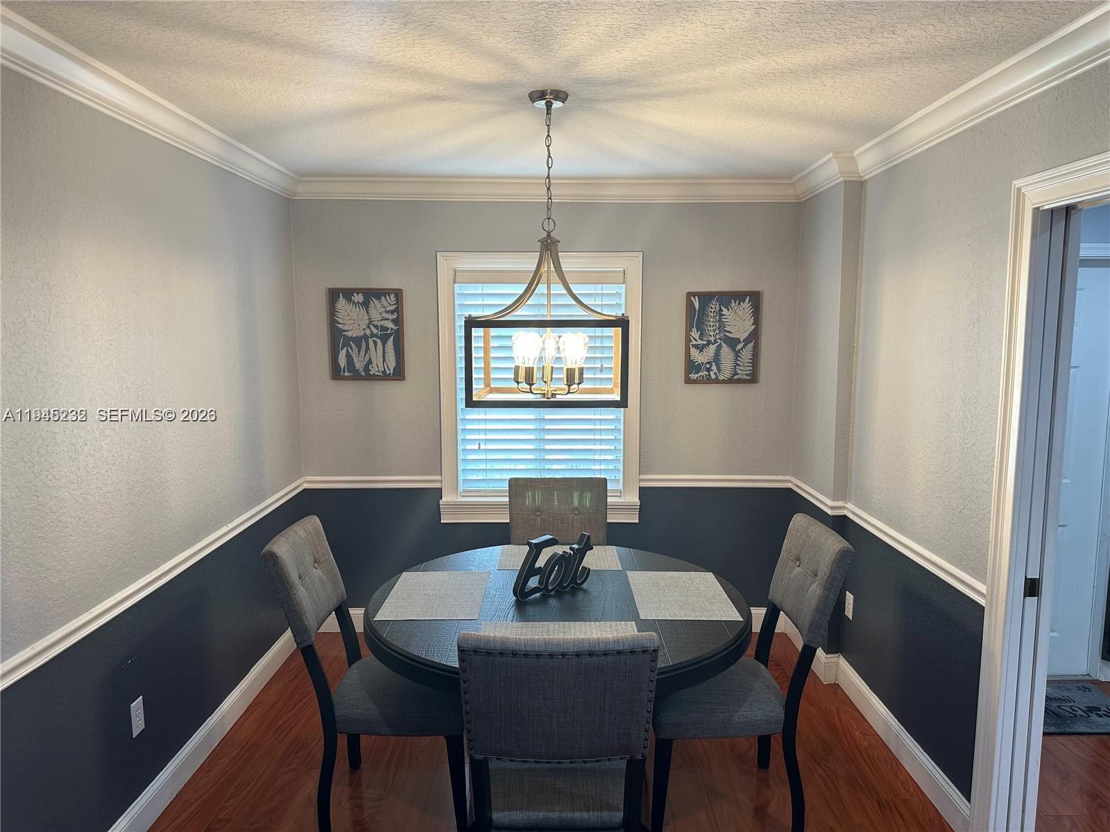 9891 Northwest 24th Street Sunrise, FL 33322 - Photo 3 of 8 a view of a dining room with a table and chairs
