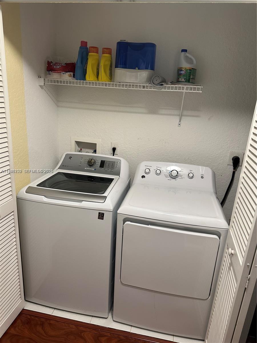 9891 Northwest 24th Street Sunrise, FL 33322 - Photo 6 of 8 a utility room with dryer and washer
