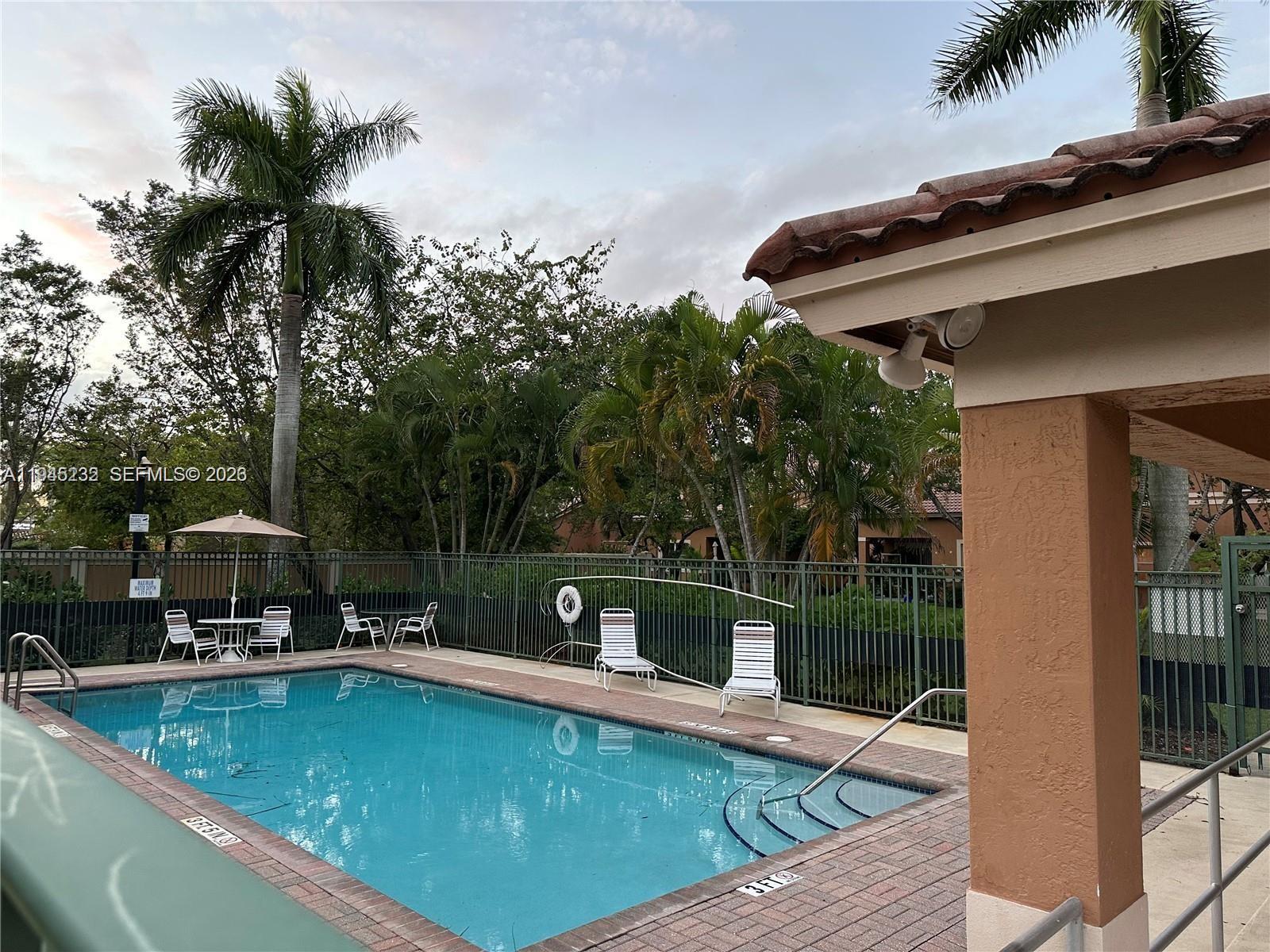 9891 Northwest 24th Street Sunrise, FL 33322 - Photo 8 of 8 a view of a swimming pool with a patio