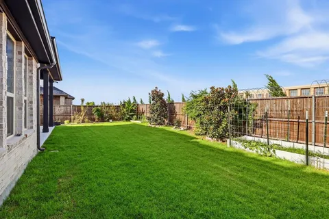 a view of a garden from a balcony
