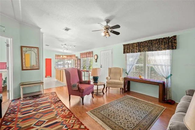 a living room with furniture rug and window