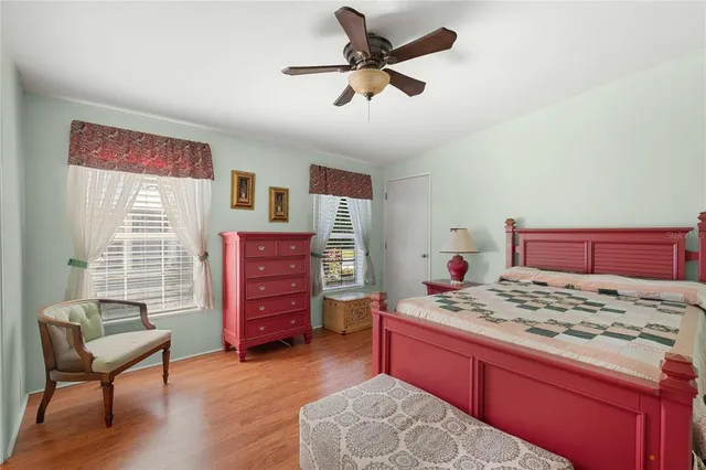 a bedroom with a bed and a dresser in it