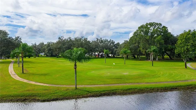 a view of a golf course with a big yard
