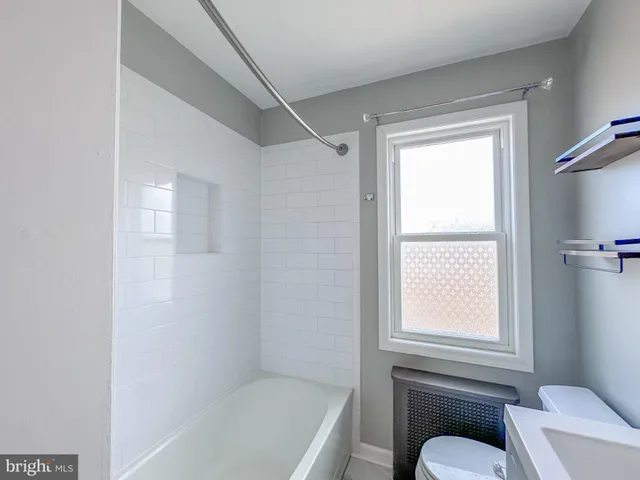a bathroom with a toilet sink and bathtub