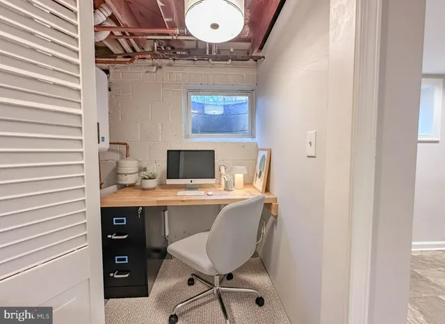 a view of a workspace with furniture