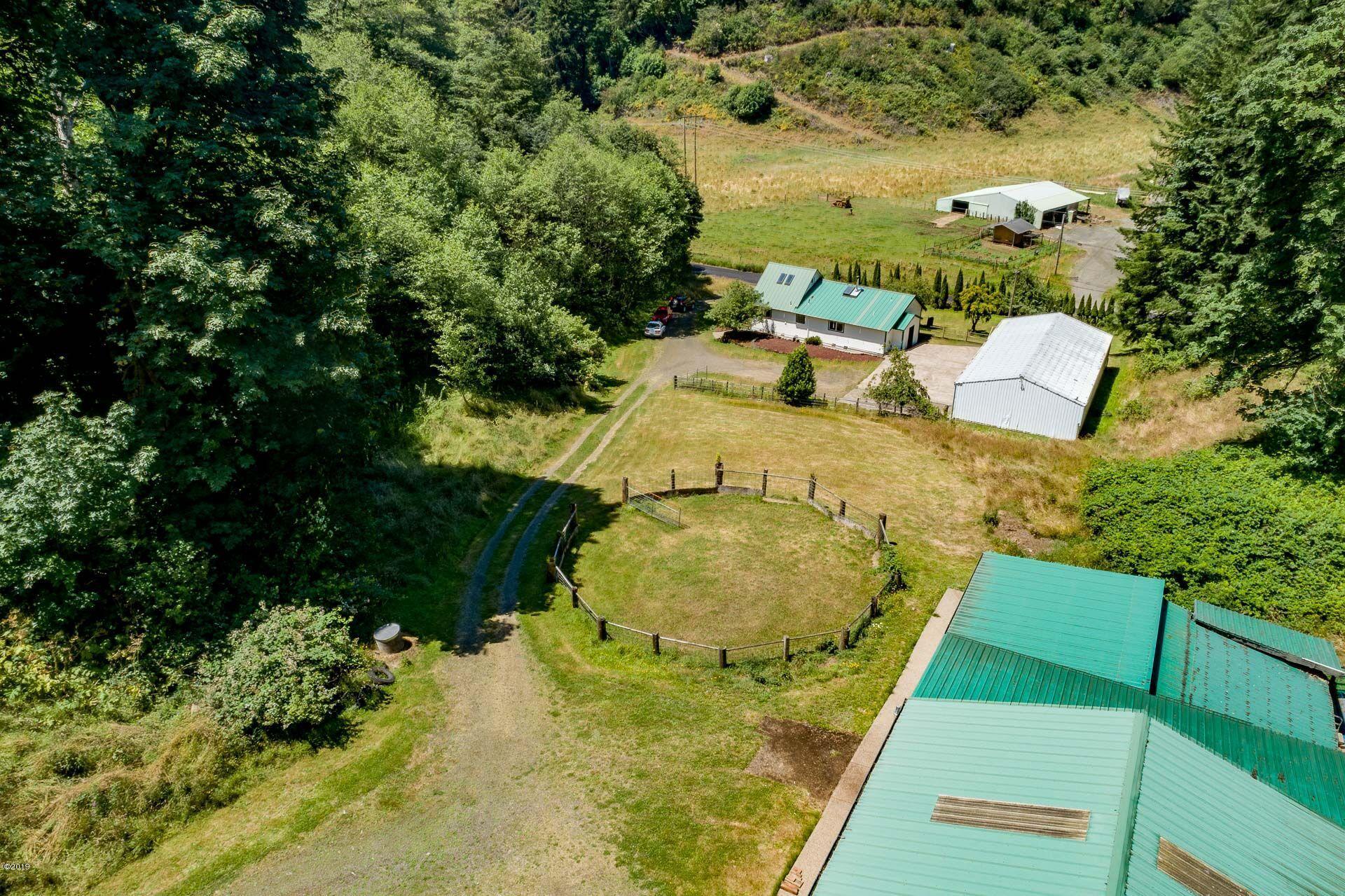 429 Hidden Valley Road Toledo, OR 97391 - Photo 36 of 41 DRONE OF BUILDING TOPS