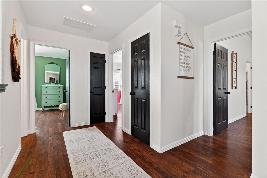 7675 Michael Road Sanger, TX 76266 - Photo 22 of 40 a view of a hallway with wooden floor and closet