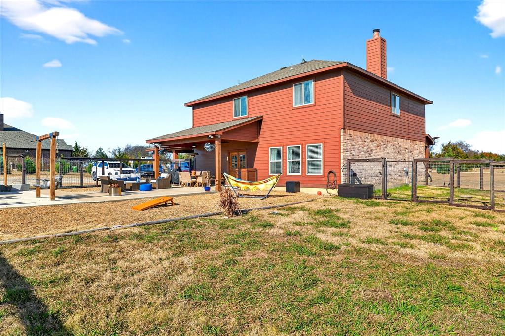 7675 Michael Road Sanger, TX 76266 - Photo 34 of 40 a view of a house with a yard