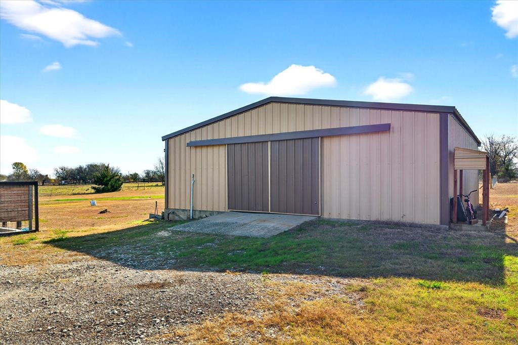 7675 Michael Road Sanger, TX 76266 - Photo 35 of 40 a view of a house with backyard and ocean view